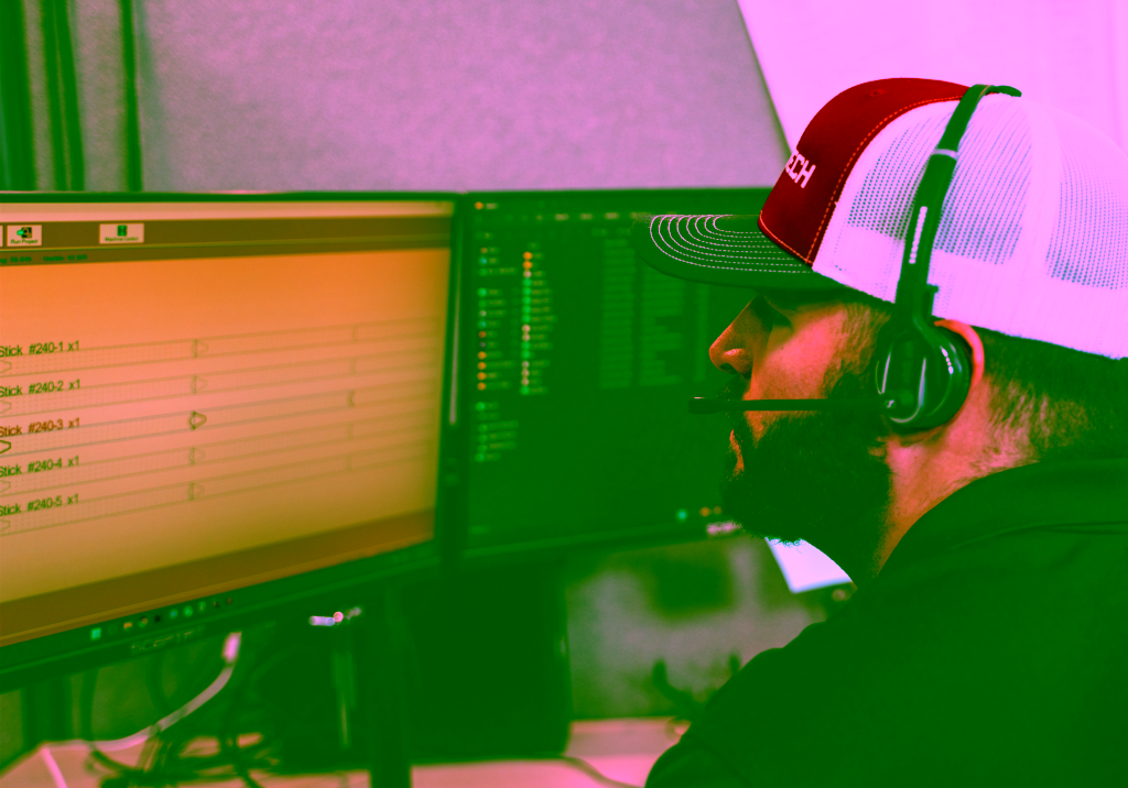 alt=Image of an Applications Engineer working with Bend-Tech Software on two computer screens